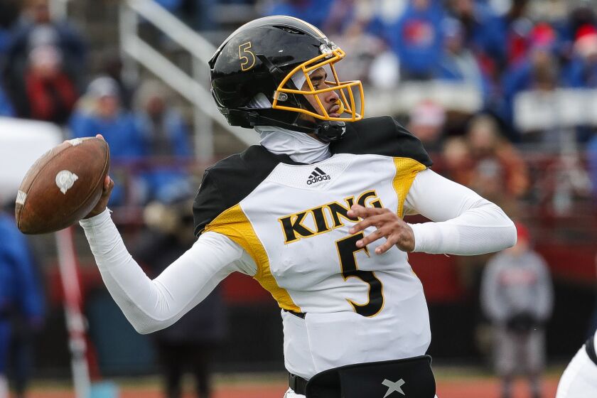 Quarterback Dante Moore of Detroit's King High looks to pass during a Division 3 state semifinal game Nov. 19, 2022.