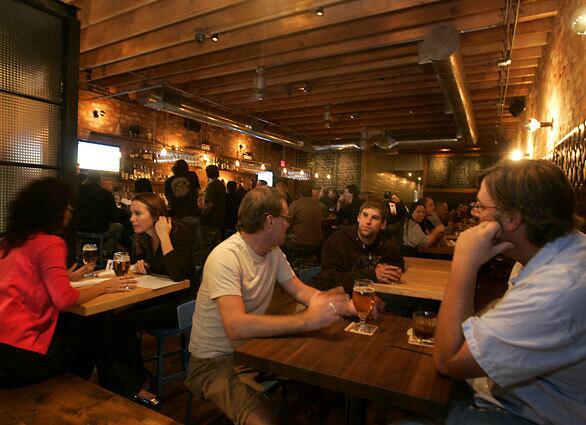 People enjoy beers at Laurel Tavern on Ventura Blvd. in Studio City. The tavern is one of the new breed of contemporary American pubs sweeping into southern California.