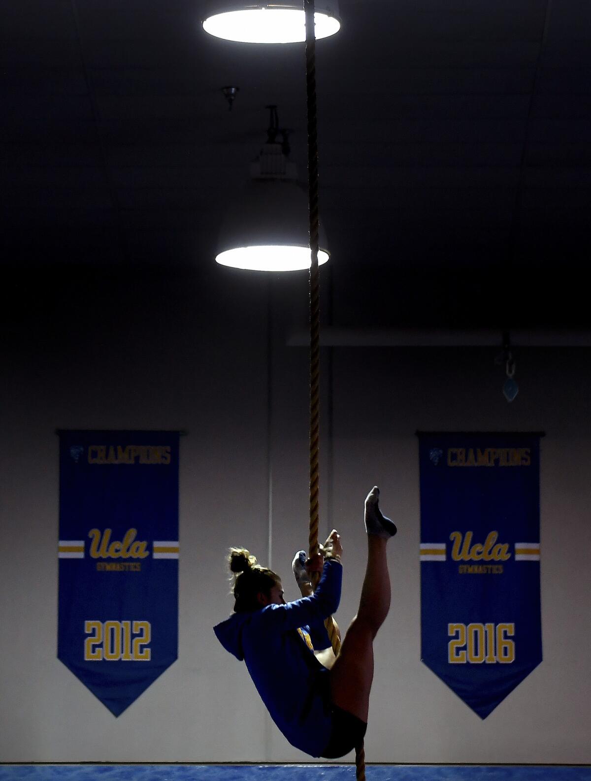 UCLA's Pauline Tratz climbs a rope during a workout on the UCLA campus.