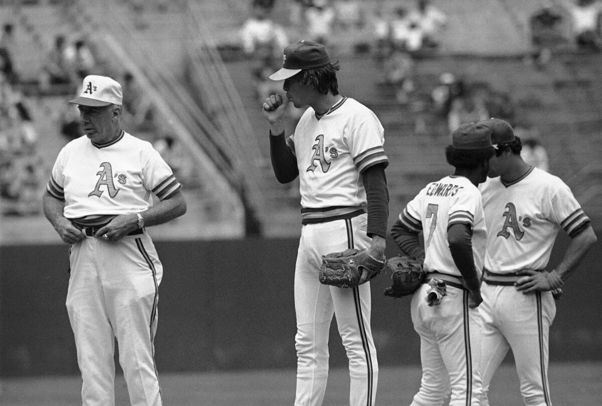 Oakland A's pitcher Matt Keough sucks on his thumb after attempting to catch a fly ball from Milwaukee Brewers right fielder Ben Oglivie in the fourth inning during the first game of a doubleheader at Oakland Coliseum on May 21, 1979.