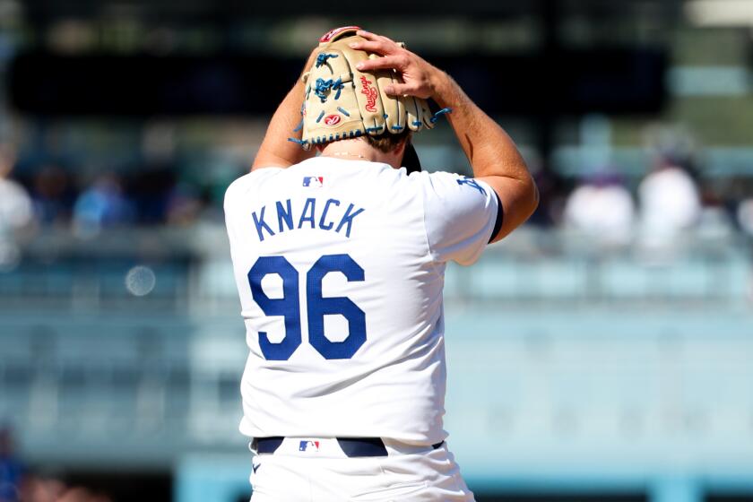 LOS ANGELES, CALIFORNIA - OCTOBER 14: Landon Knack #96 of the Los Angeles Dodgers reacts.