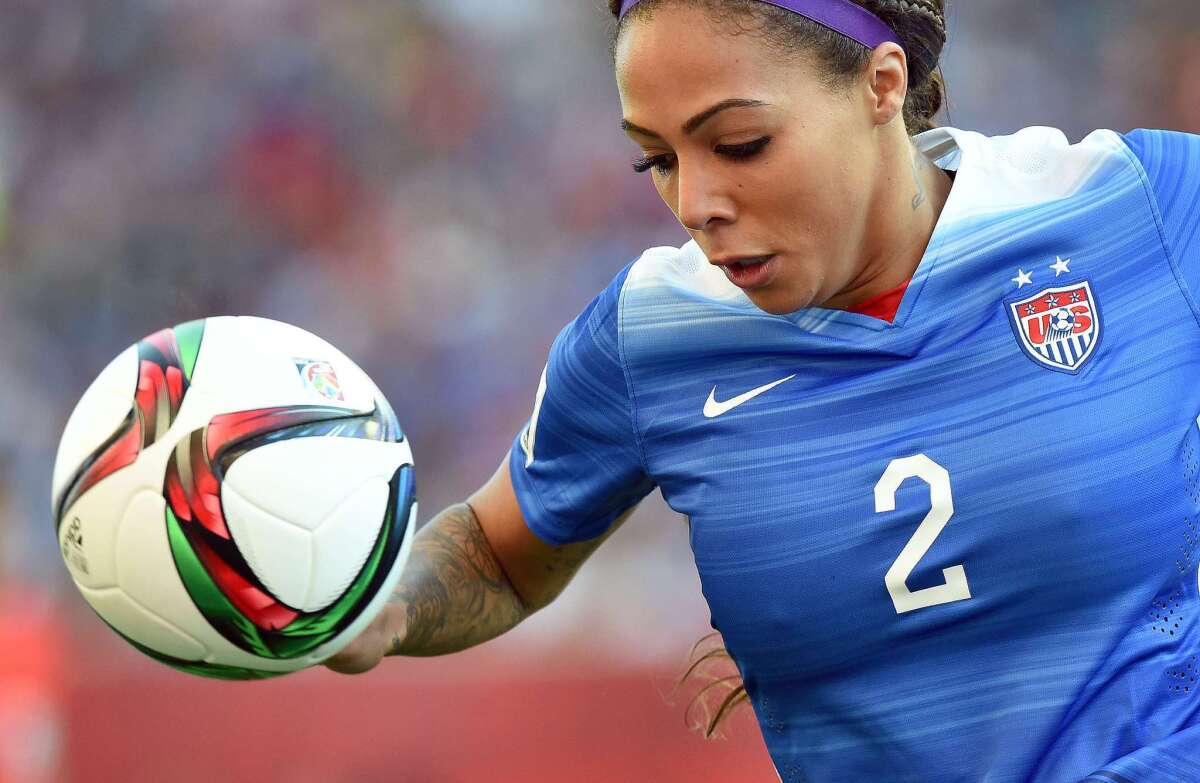 U.S. forward Sydney Leroux runs with the ball at Sweden's goal post during the Women's World Cup on June 12.