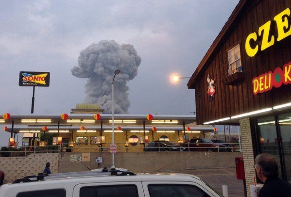A cloud of smoke rises from a fertilizer plant where an explosion occurred in West, Texas.