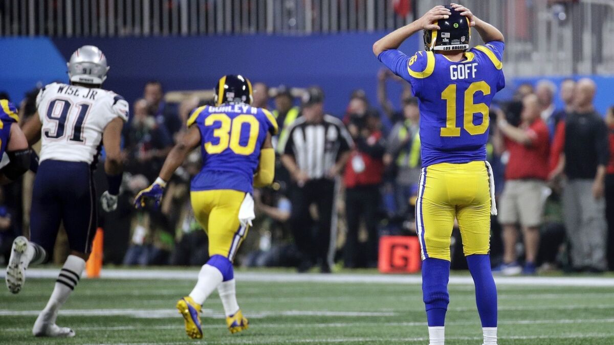 Rams quarterback Jared Goff reacts after throwing an interception against the Patriots.