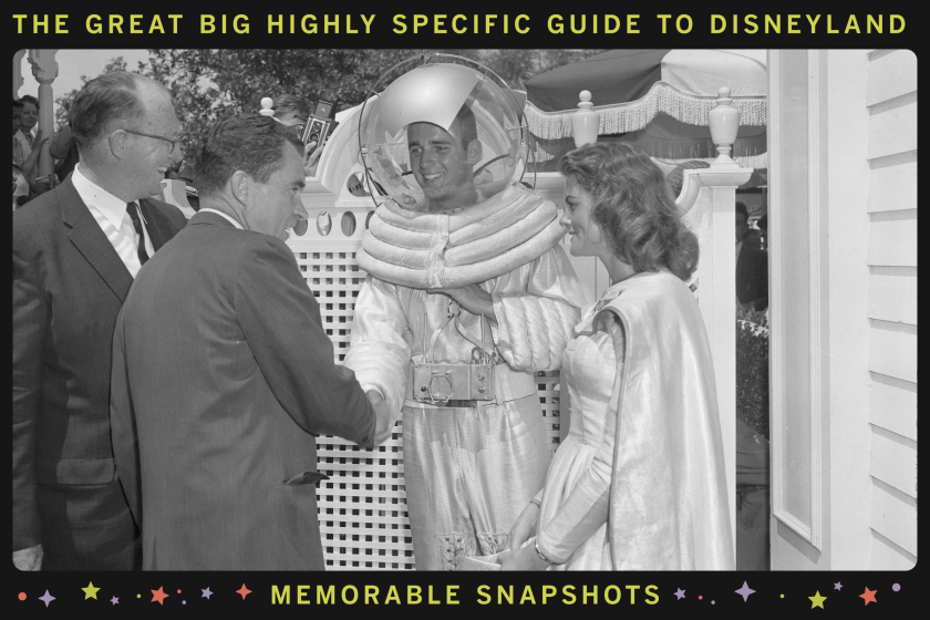 A man and a woman in space suits shake the hands of suited gentlemen.