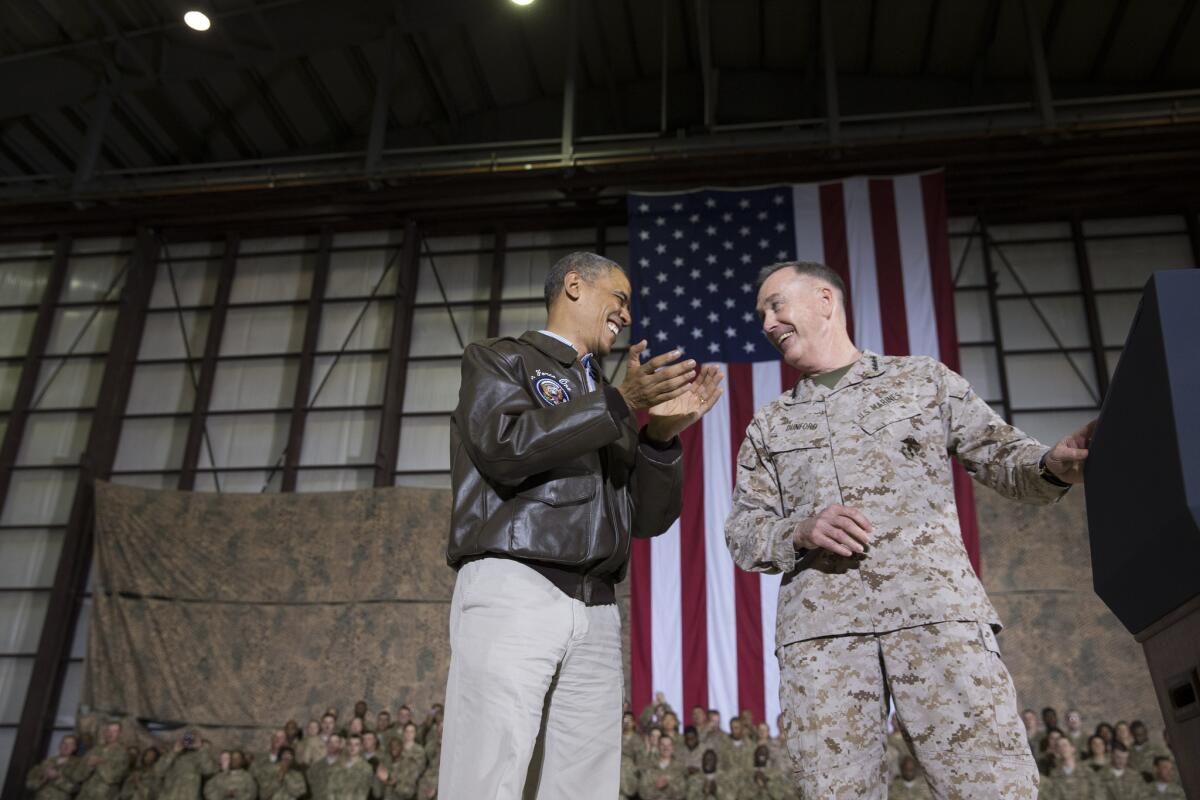 President Obama and Marine Gen. Joseph Dunford converse during the president's surprise May 25 visit with the troops in Afghanistan.