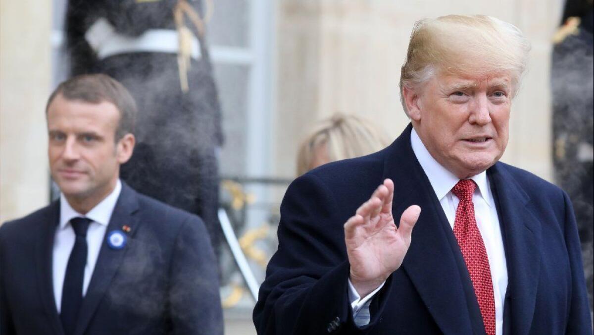 President Trump, right, at the Elysee Palace in Paris on Saturday following bilateral talks with French President Emmanuel Macron.