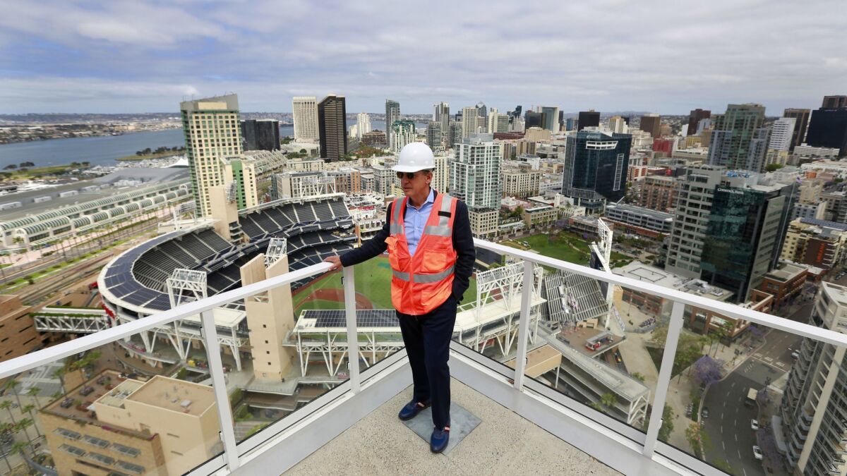 Jerry Brand, senior managing director for Greystar, looks over the 32nd floor deck of Park 12, a luxury apartment building near Petco Park.