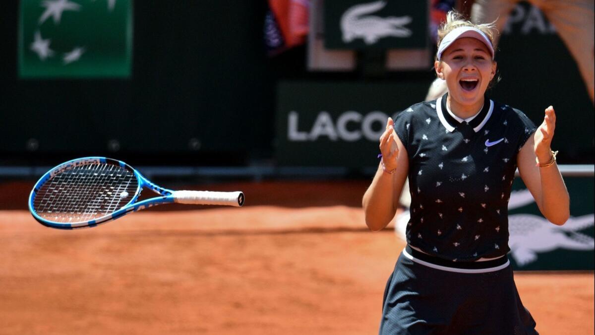 Amanda Anisimova celebrates after winning against Romania's Simona Halep at the end of their French Open quarterfinal match June 6.