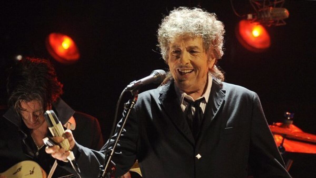 Bob Dylan is set for his first San Diego concert since 2016. He is shown above with one of his band members, lead guitarist Charlie Sexton.