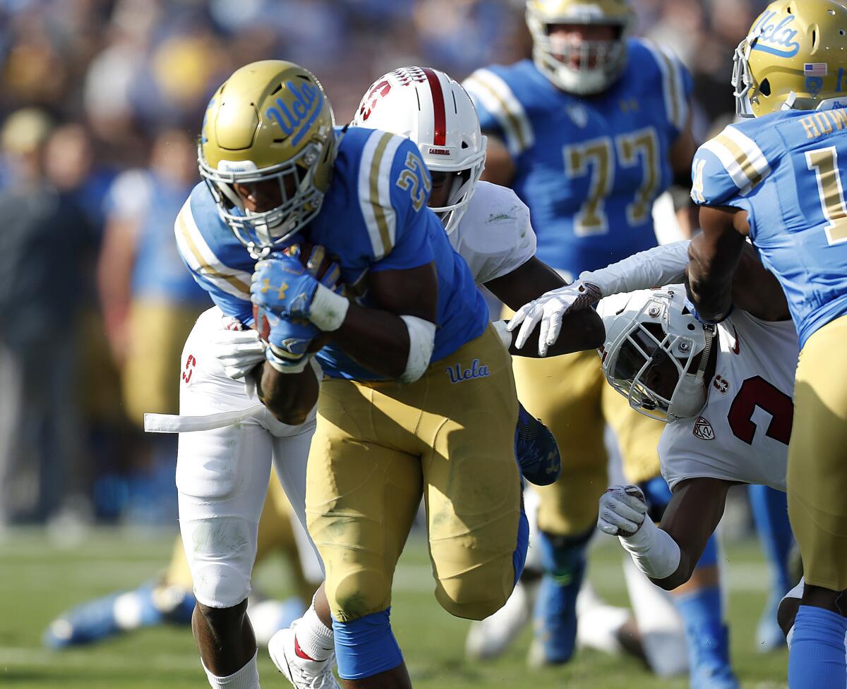 UCLA running back Joshua Kelley breaks through for a touchdown against Stanford in the second quarter on Nov. 24.
