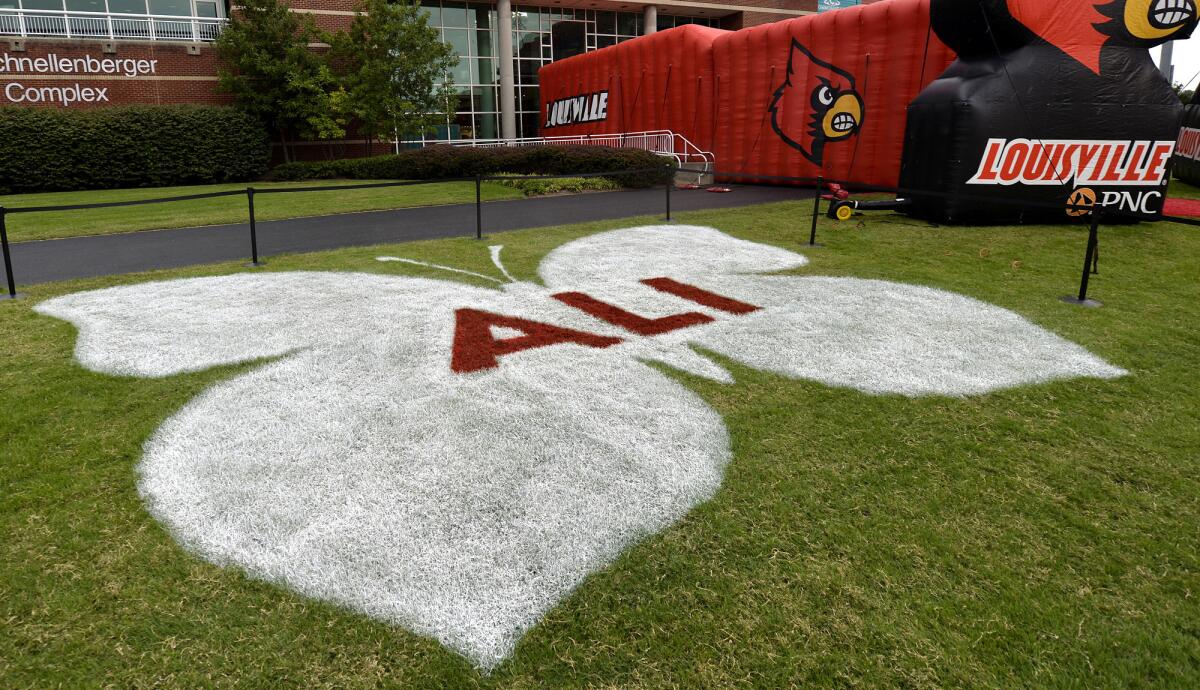 A 30-foot butterfly beyond an end zone at Papa John Stadium in Louisville honors boxing legend Muhammad Ali.