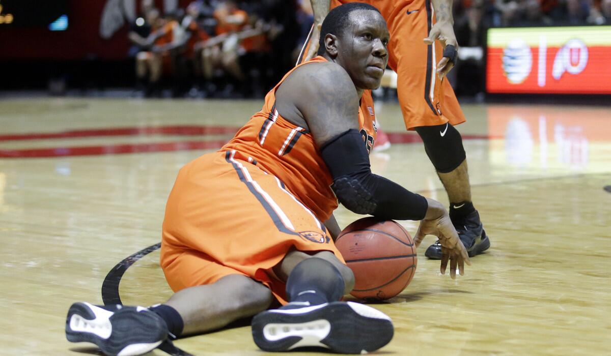 Oregon State forward Jarmal Reid looks for eye contact with the referee after falling to the floor in the second half against Utah on Sunday.