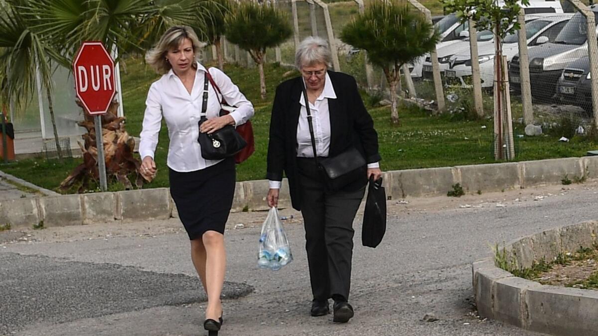 Jailed pastor Andrew Brunson's wife, Norine Brunson, left, arrives at a courthouse near Izmir, Turkey, on Monday for her husband's trial.