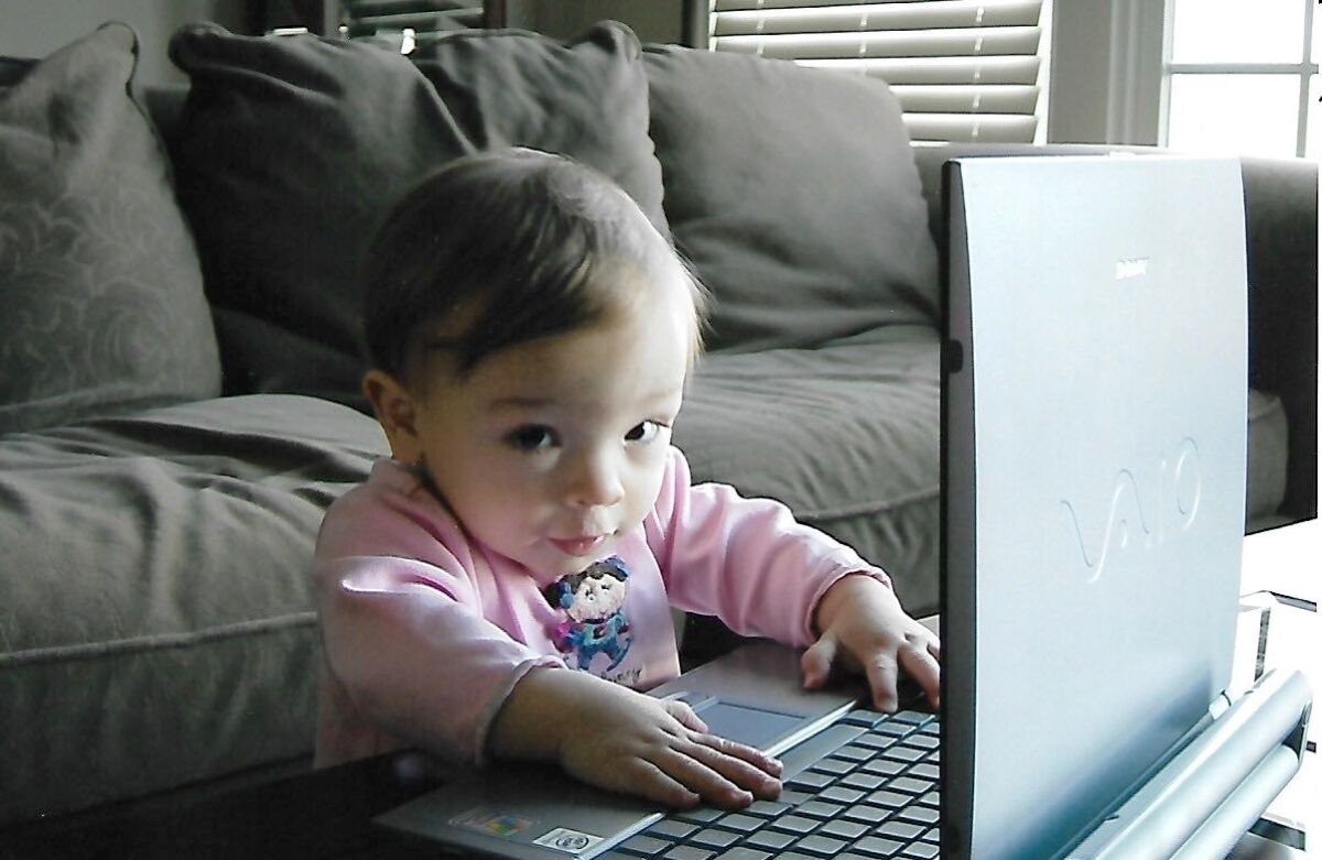 A 1-year-old Meredith Hunter shows her early interest in computers.