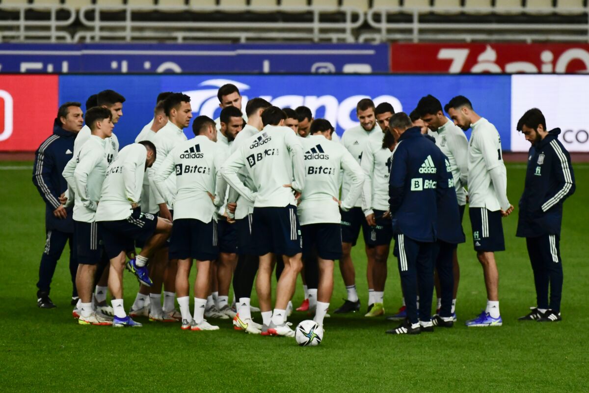 Spain head coach Luis Enrique, fourth from right, gives instructions during a training session at the Olympic stadium in Athens, Greece, Wednesday, Nov 10, 2021. Spain will play against Greece for the World Cup 2022 group B qualifying soccer match. (AP Photo/Michael Varaklas)