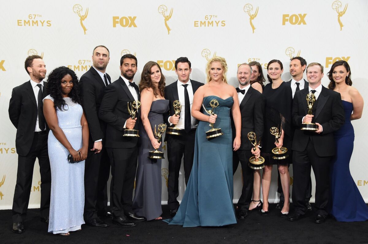 LOS ANGELES, CA - SEPTEMBER 20: Comedian Amy Schumer (C) and writers and producers of "Inside Amy Schumer", winners of Outstanding Variety Sketch Series, pose in the press room at the 67th Annual Primetime Emmy Awards at Microsoft Theater on September 20, 2015 in Los Angeles, California. (Photo by Jason Merritt/Getty Images) ** OUTS - ELSENT, FPG - OUTS * NM, PH, VA if sourced by CT, LA or MoD **
