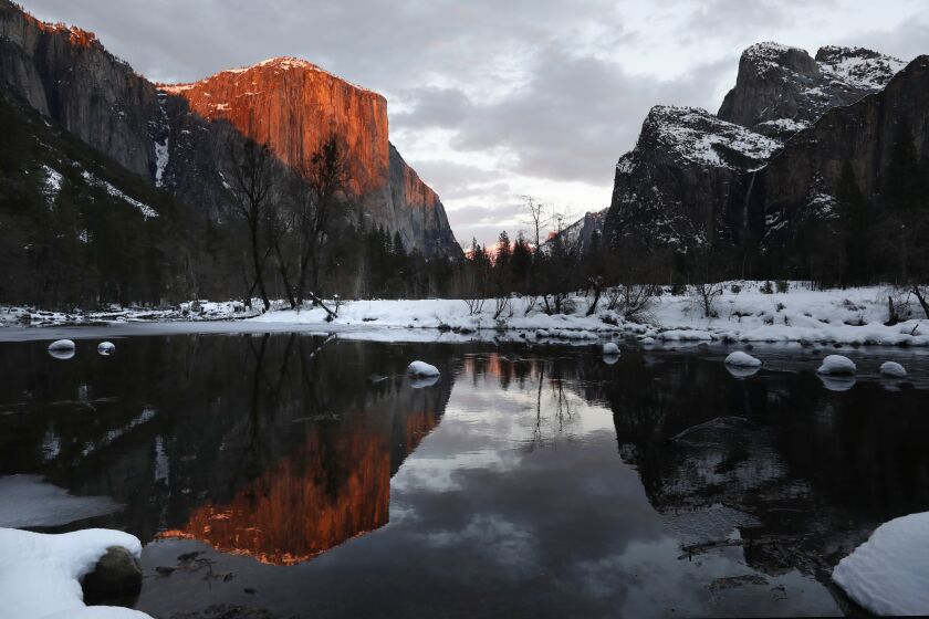 Yosemite National Park, California-Feb. 1, 2021-Yosemite National Park is reopen after being closed since Jan. 19, 2021, when a snow and wind storm caused hazardous conditions. El Capitan is reflected in the Merced River at sunset on Feb. 1, 2021. The park received several feet of snow during the last storm. (Carolyn Cole/Los Angeles Times)