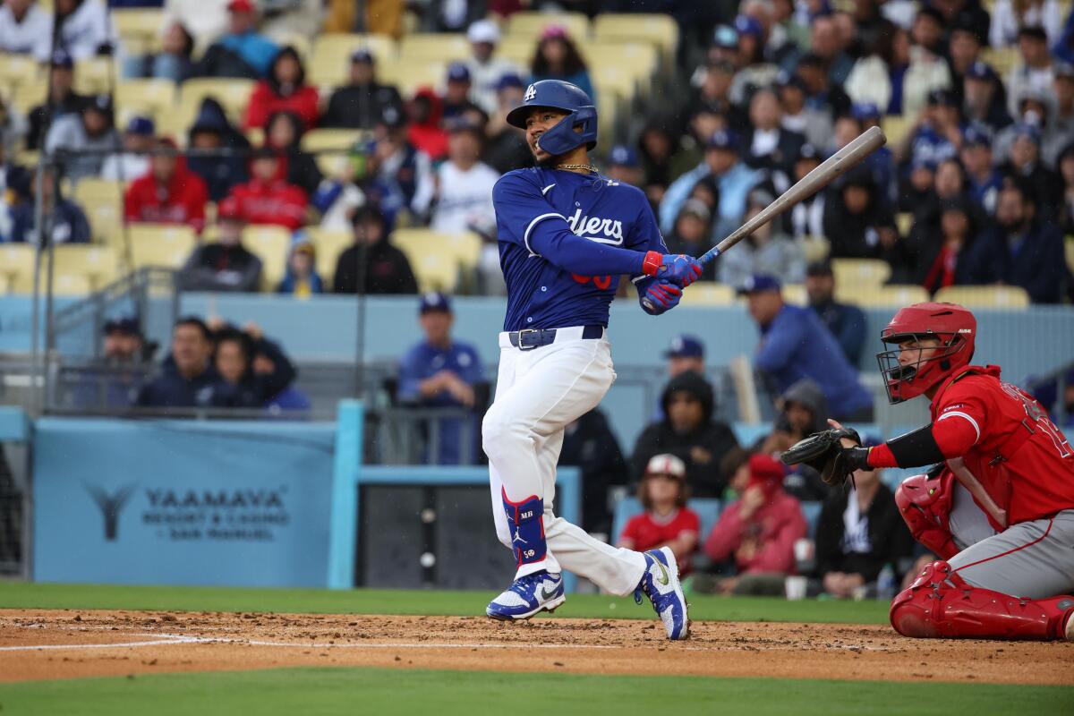 Dodgers star Mookie Betts bats against the Angels on Sunday at Dodger Stadium.