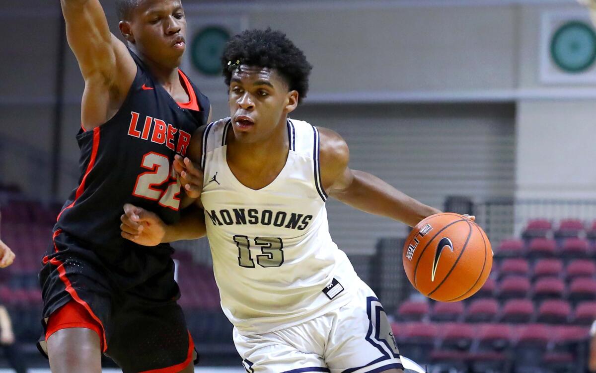 Mayfair guard Joshua Christopher drives against Henderson (Nev.) Liberty forward Jordan Wafer.