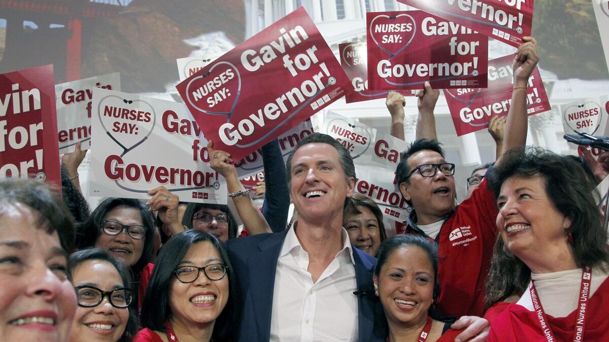 Gov.-elect Gavin Newsom at his 2015 meeting with more than 1,000 registered nurses from California and cross the nation in Los Angeles. Newsom offered his support for California Nurses Assn. proposal for a universal healthcare system, and the nurses now expect him to deliver.