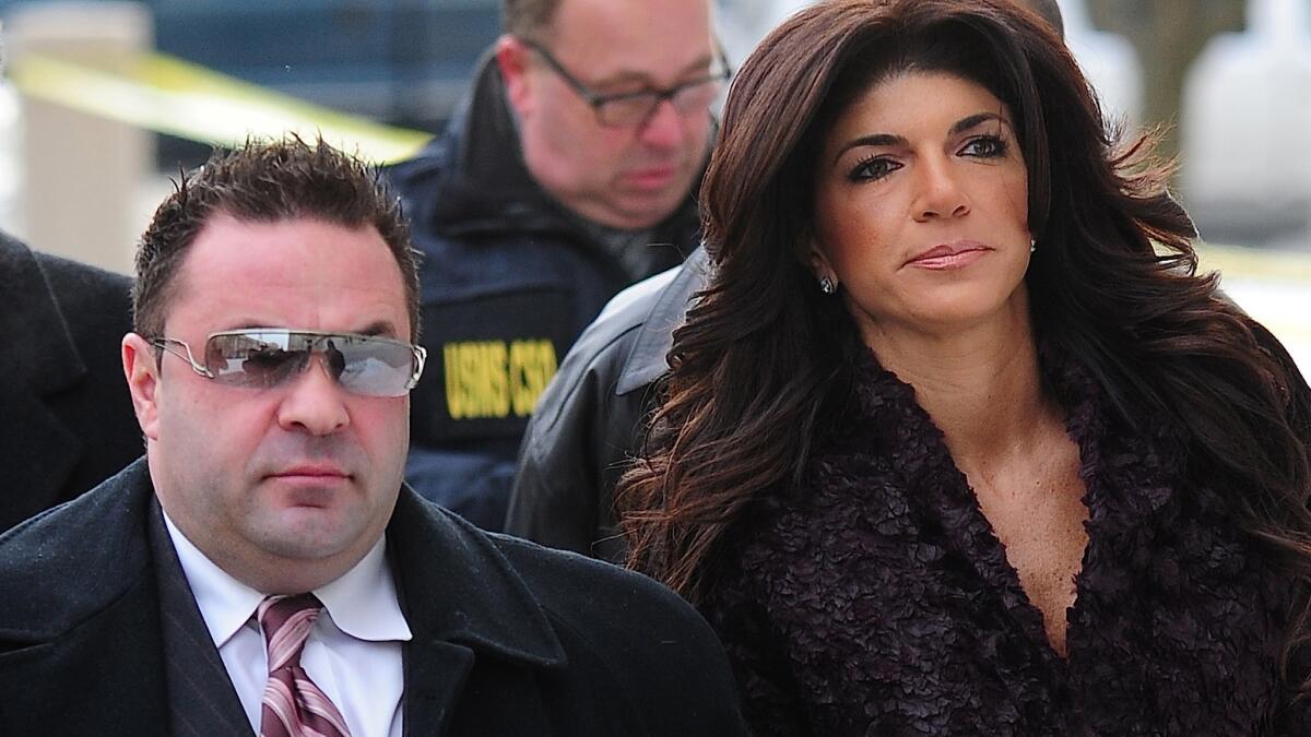 Joe Giudice, with Teresa Giudice outside a federal courthouse in March 2014, welcomed his wife home from prison on Wednesday.