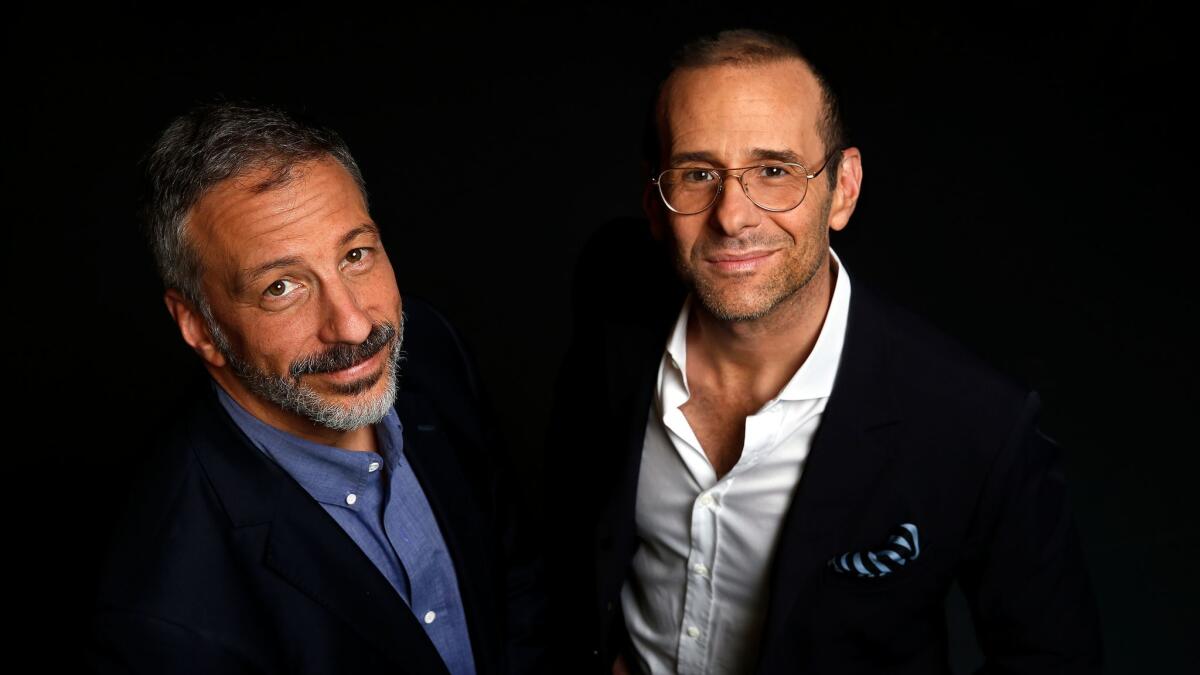 David Kohan, left, and Max Mutchnick, the creators of "Will & Grace," talk about bringing back the NBC hit during a break from writing on the NBCUniversal lot.