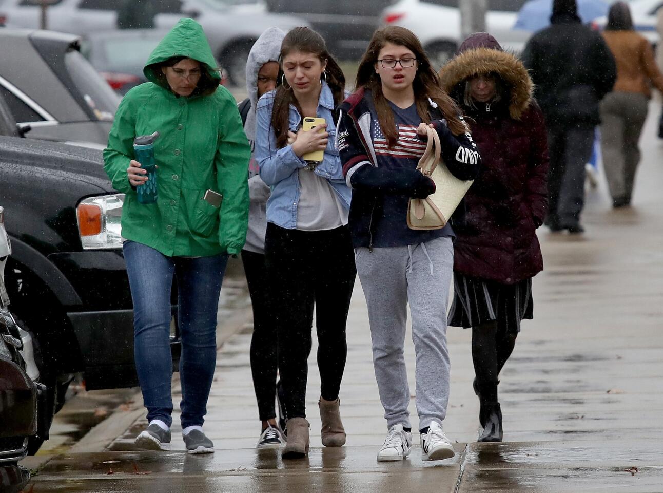 Students from Great Mills High School walk to meet their parents at Leonardtown High School following a school shooting at Great Mills High School on March 20, 2018 in Leonardtown, Md.