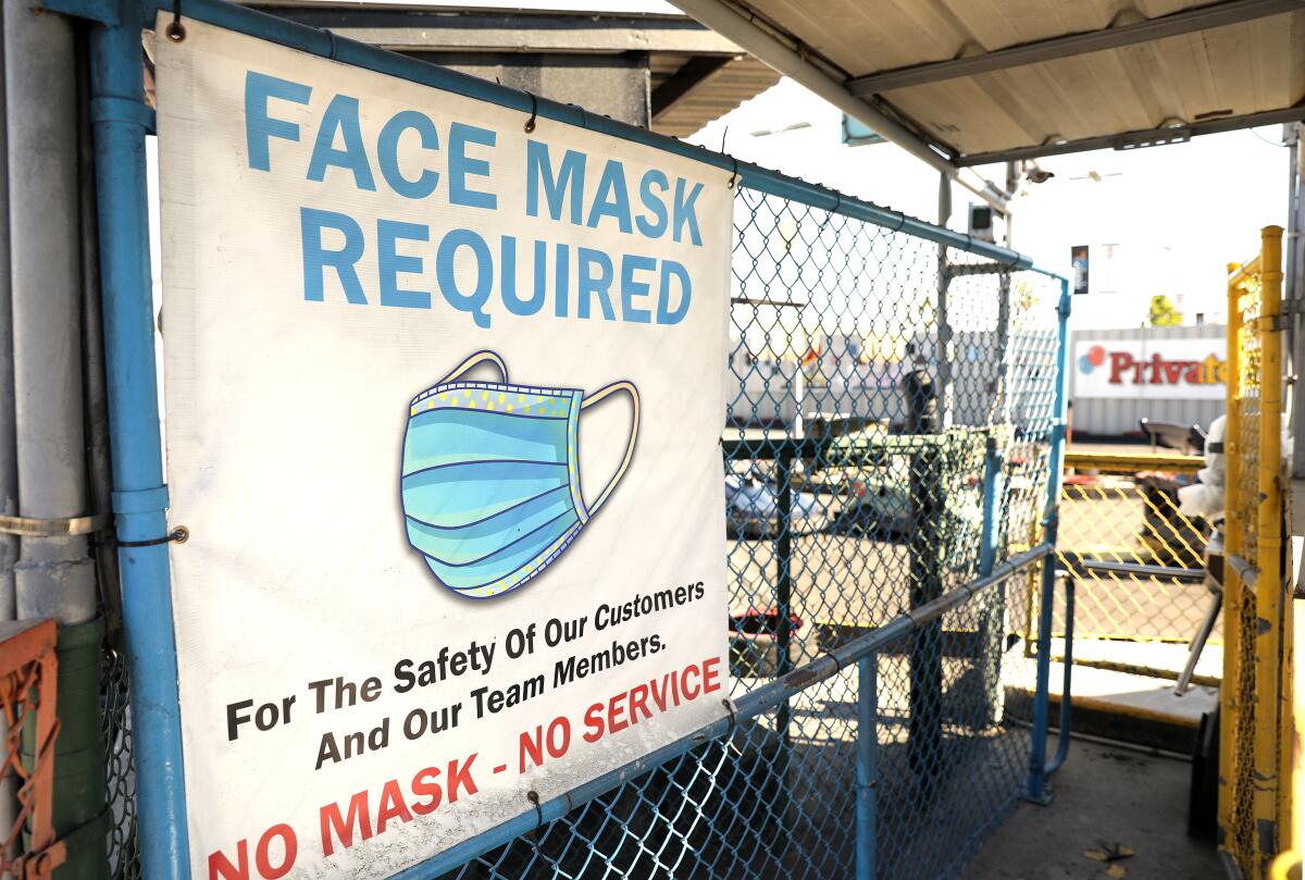 A sign at Go Kart World says customers are required to wear masks.