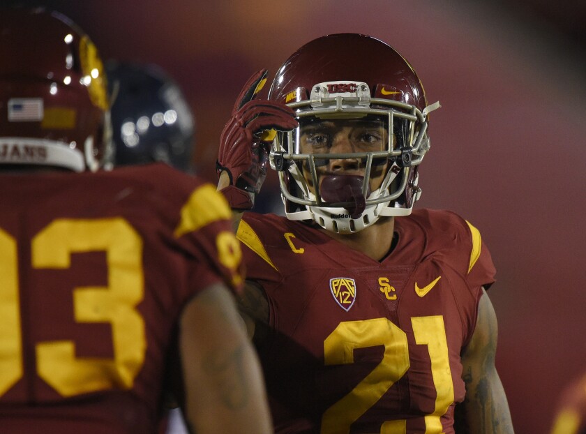 USC linebacker Su'a Cravens, right, talks with defensive end Greg Townsend Jr. during a game against Arizona on Nov. 8.