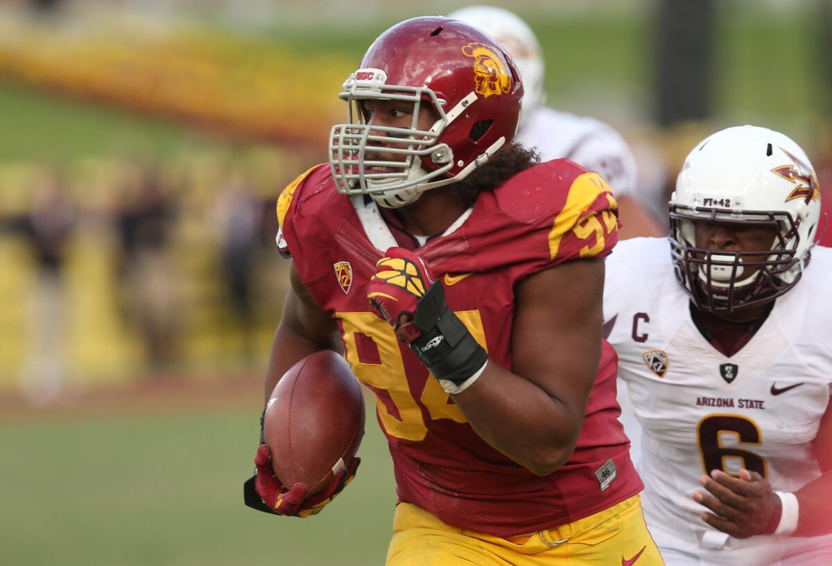 Leonard Williams of USC returns an interception in the fourth quarter against the Arizona State Sun Devils.