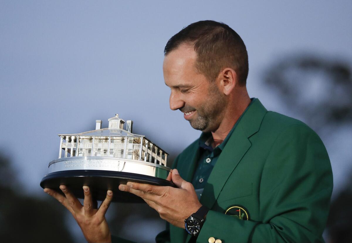 Sergio Garcia admires the winner's trophy during the awards ceremony following his victory at the 2017 Masters.