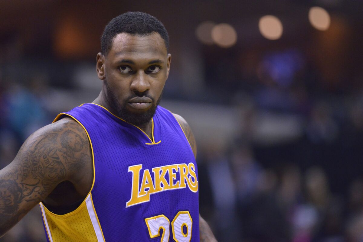 Lakers forward Tarik Black looks on in the first half of a game against the Grizzlies on Dec. 3.