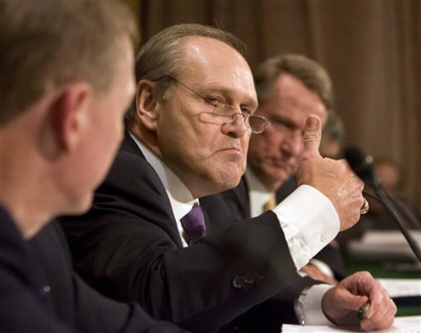 Chrysler CEO Robert Nardelli testifies at a Senate Banking, Housing and Urban Affairs hearing on the automotive industry bailout on Capitol Hill in Washington, Tuesday, Nov. 18, 2008. At left is Ford CEO Alan Mulally and right is General Motors CEO Rick Wagoner. (AP Photo/Manuel Balce Ceneta)