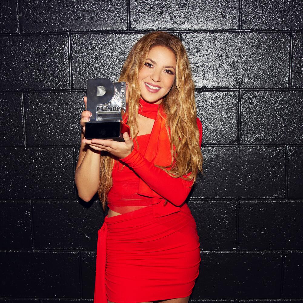 Shakira with an award