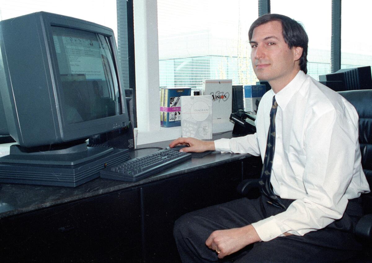 Steve Jobs shown in 1991 with a NeXTstation computer.