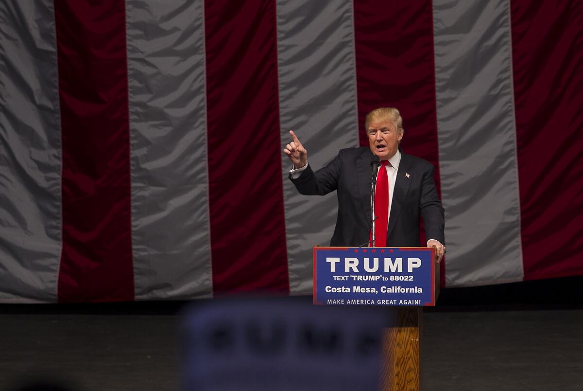 Donald Trump talks to a packed housed inside the Pacific Amphitheatre at the Orange County fairgrounds on Thursday.