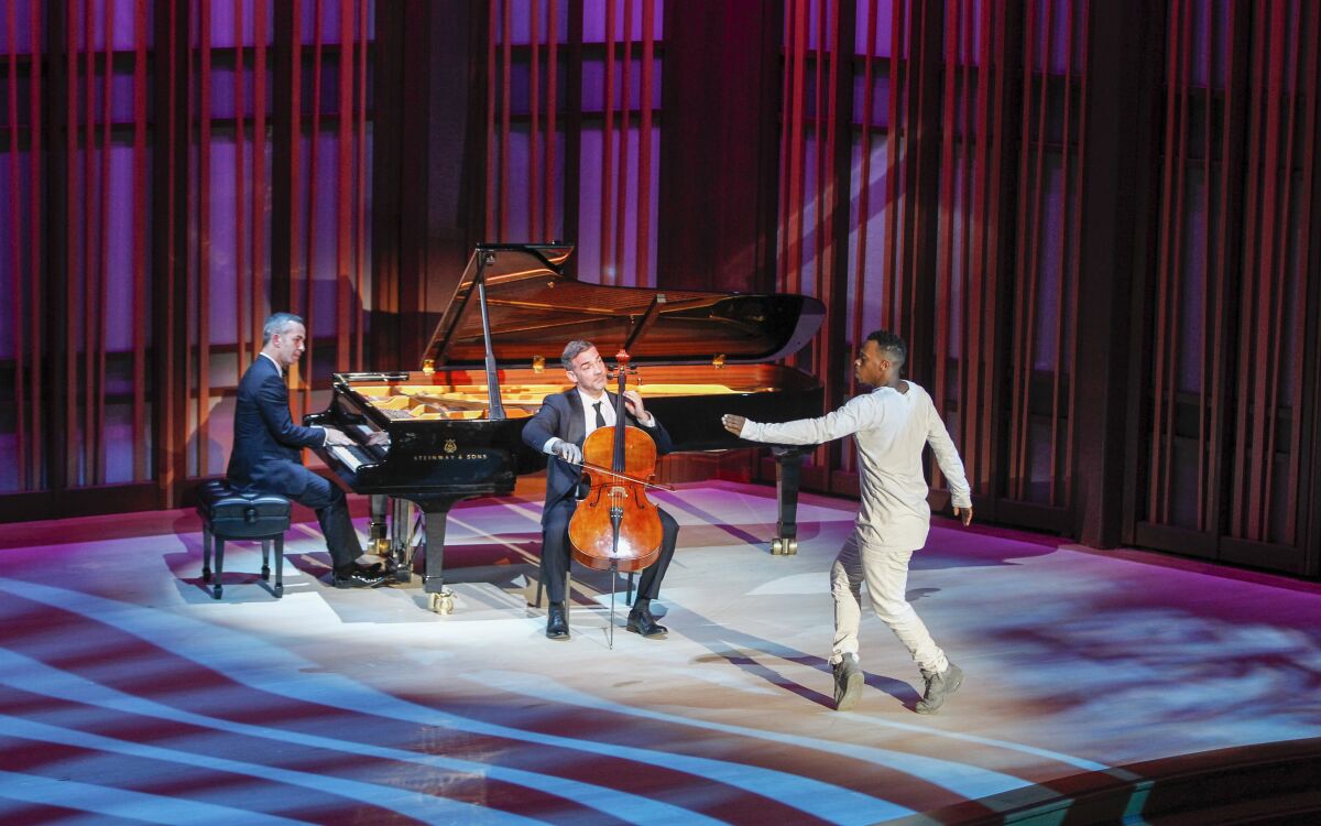 Trio members (from right) Charles "Lil Buck" Riley (dancer), Joshua Gindele (cello), and Inon Barnatan (piano) perform.