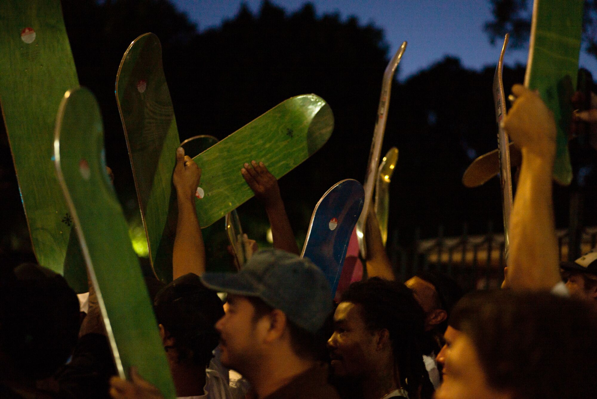 A photo of skateboards in the air.