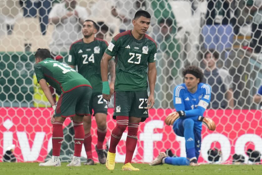 Mexico's Jesus Gallardo, center, reacts after Saudi Arabia scored a goal during the World Cup group C soccer match between Saudi Arabia and Mexico, at the Lusail Stadium in Lusail, Qatar, Wednesday, Nov. 30, 2022. (AP Photo/Ricardo Mazalan)