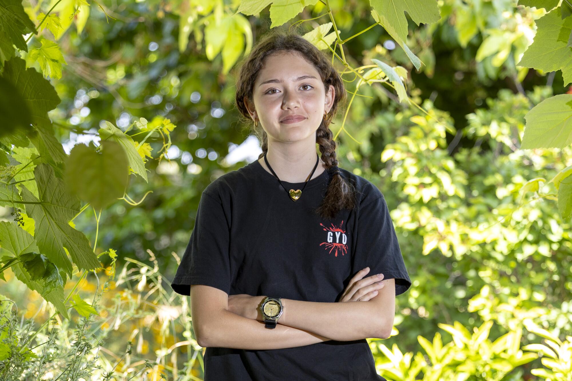 Sophia Perez smiles with crossed arms.