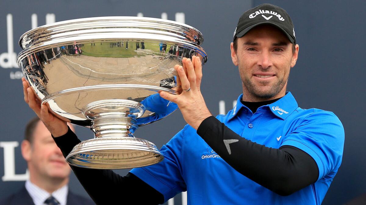 Oliver Wilson celebrates his victory at the Dunhill Links Championship in Scotland on Sunday.