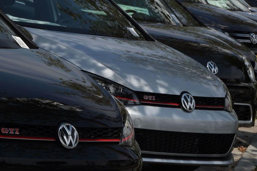 Huge demand in China may be enough to push Volkswagen's 2016 sales past Toyota's. Above, VW cars sit on a lot at a dealership in Los Angeles.