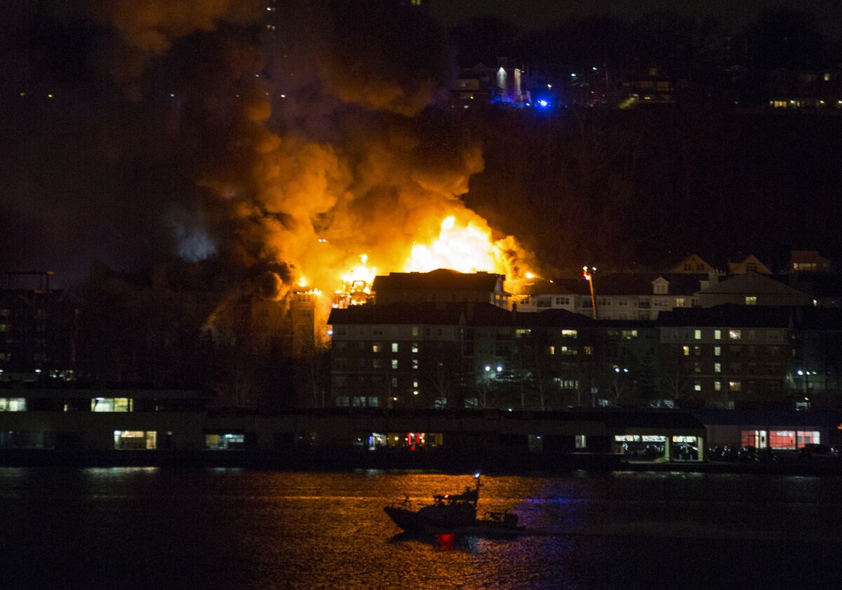 Smoke billows from a multi-alarm fire burning in Edgewater, N.J., as seen in New York from across the Hudson River, on Jan. 21, 2015.
