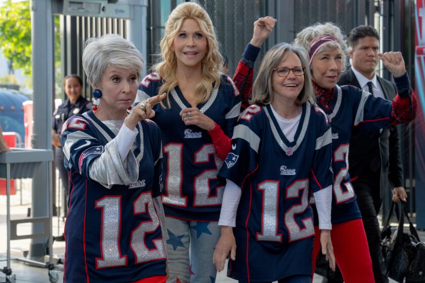 Four older women wearing number twelve New England Patriots jerseys in the movie "80 For Brady."