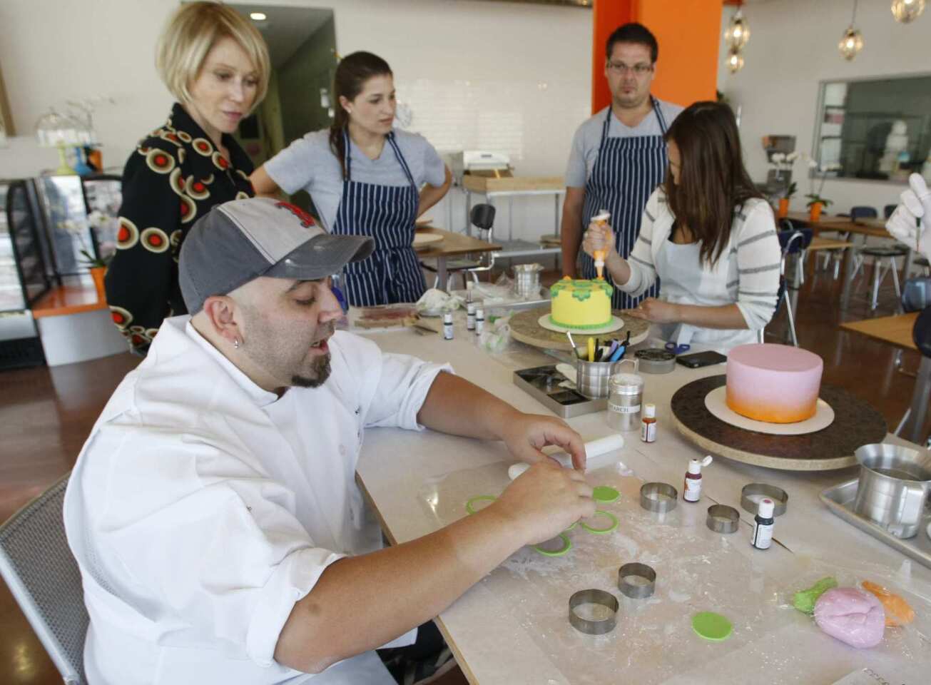 Celebrity baker Duff Goldman's Cakemix is a hands-on retail component next to his Charm City Cakes West on Melrose Avenue in L.A. Customers can design and decorate their own cakes. Here, Goldman shows how to make shapes from colored fondant.
