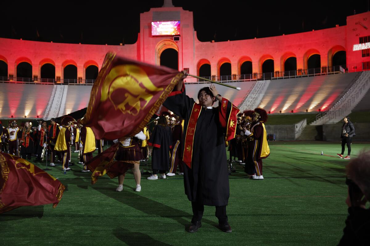 USC Silks member Jerico Dimataga performs at the "Troy Family graduation party," at the Coliseum on May 9.