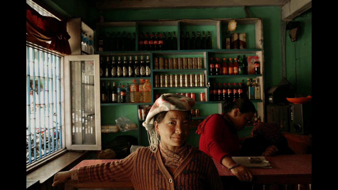 Two women work in a restaurant in Kodari, Nepal, a busy border town with China where many goods are coming into Nepal. China is pumping a lot of money into the economy. Two women work in a restaurant in Kodari.