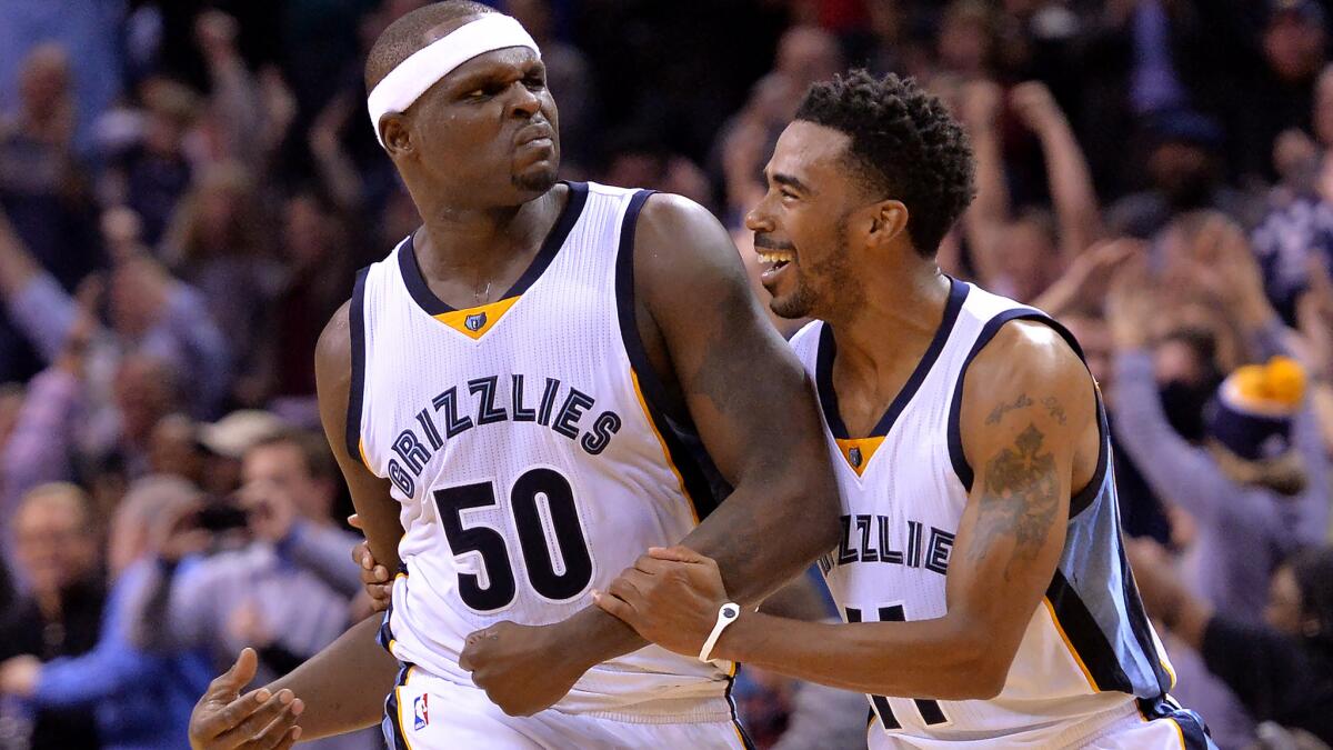 Grizzlies forward Zach Randolph (50) celebrates with point guard Mike Conley after making the winning basket against the Portland Trail Blazers during a game in Memphis, Tenn., on Nov. 13, 2015.