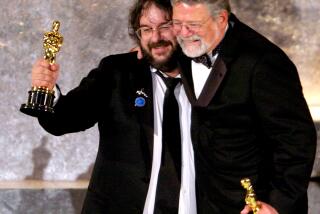 Director Peter Jackson, left, and producer Barrie M. Osborne accept the award for best picture for "Lord of the Rings: Return of the King" at the 76th Annual Academy Awards show in Los Angeles Sunday, Feb. 29, 2004. (AP Photo/Mark J. Terrill)